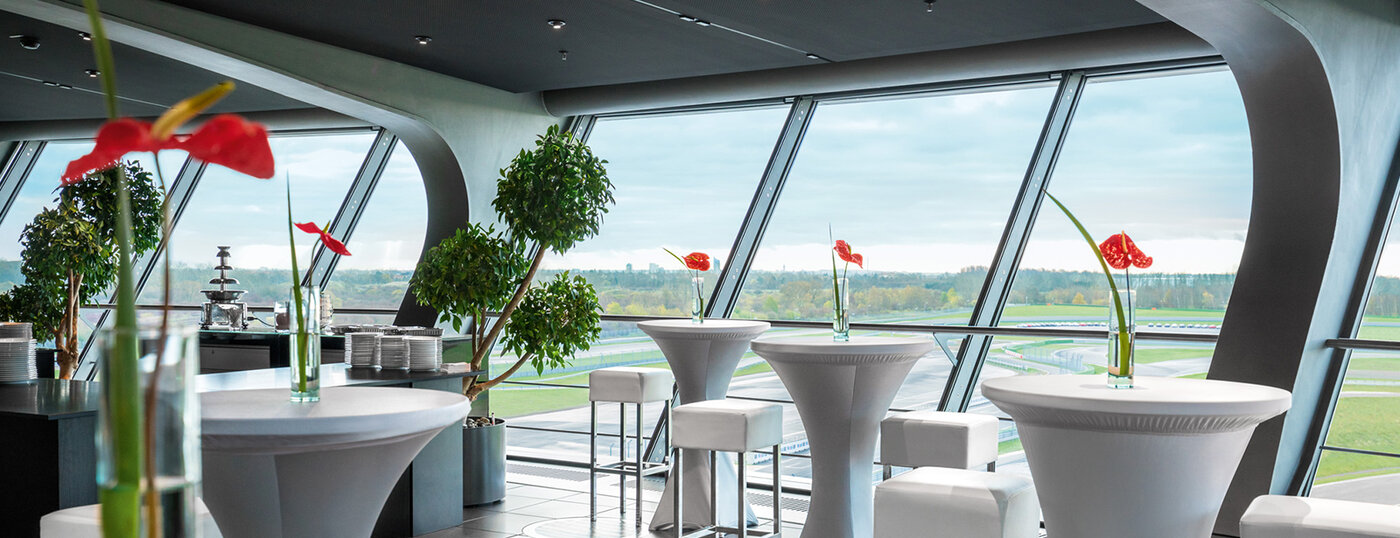 High tables with bar stools. Panoramic windows overlooking the circuit. 