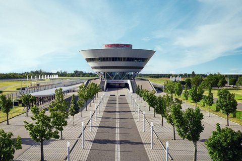 Eine Luftaufnahme des Porsche experience Center, Leipzig inklusive vorgelagerten Parkplatz